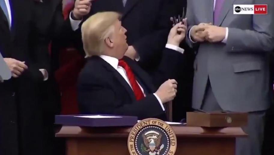 Trump Appears to Mock Pelosi by Handing Out Pens at Signing Ceremony